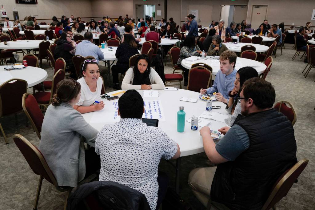 Participants work at tables to list ideas for a better Alaska during a Special Native Issues Forum at Elizabeth Peratrovich Hall on Tuesday, July 30, 2019. The forum was sponsored by Tlingit Haida, First Alaskans Institute, Native Peoples Action and Sealaska. (Michael Penn | Juneau Empire)