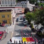 Pedestrians cross Front Street at Main where the city is in the middle of a multi-day project to paint the crosswalk in rainbow colors on Wednesday, July 31, 2019. (Michael Penn | Juneau Empire)