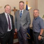 Tuckerman Babcock, Gov. Mike Dunleavy and Ben Stevens pose for a picture Wednesday in Anchorage. (Courtesy photo | Governors Office)