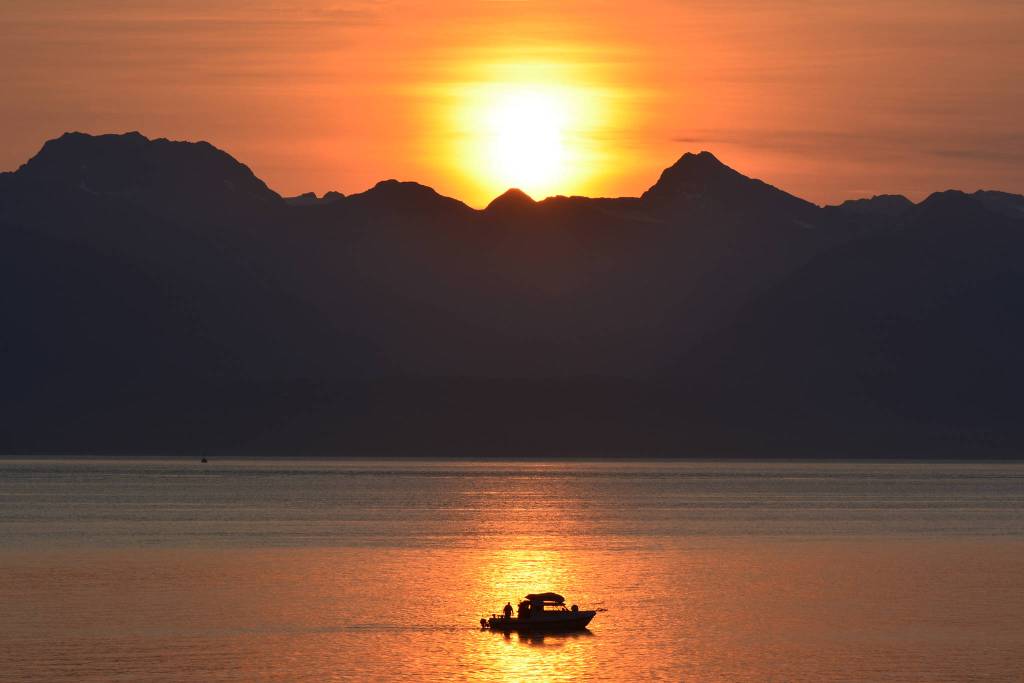 A fisherman trolls for salmon at sunset at Hand Troller Cove during calm seas on Aug. 2, 2019. (Courtesy Photo | Jerry Reinwand)