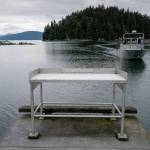 A fisherman approaches the boat launch with its current fish cleaning station at Amalga Harbor on Wednesday, June 19, 2019. (Michael Penn | Juneau Empire)