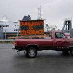 Mike Forrest, a local supporter of ferry system, drives his truck with signs at the Auke Bay Terminal on Wednesday, July 24, 2019. (Michael Penn | Juneau Empire)