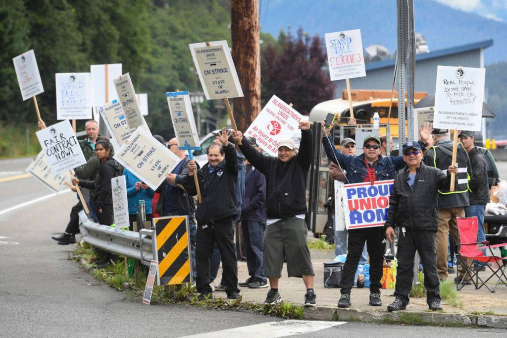 Members of the Inland Boatmens Union of the Pacific picket in front of the Auke Bay Terminal on Thursday, July 25, 2019. The union called a strike on Wednesday over failed negotiations with Gov. Mike Dunleavys administration. (Michael Penn | Juneau Empire)