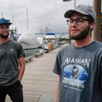 Liam Godfrey-Jolicoeur, left, and Jake Dombek, talk at Harris Harbor on Thursday, Aug. 2, 2019, about their nearly two-month long trip up the Inside Passage by canoe. Both are orginally from Vermont used the trip to raise money and bring awareness to environmental causes. (Michael Penn | Juneau Empire)