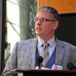Deputy Alaska health commissioner Albert Wall speaks at a news conference Monday, Aug. 5, 2019, in Anchorage, Alaska. State health department officials discussed proposals they are seeking for a study on the feasibility of privatizing Alaskas state-owned psychiatric hospital and announced the Alaska Psychiatric Institute is in good standing with federal requirements. (AP Photo/Mark Thiessen)