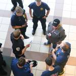 Lt. Krag Campbell briefs his group before they step off for the National Night Out, Aug. 6, 2019. (Photo by Michael S. Lockett | Juneau Empire)