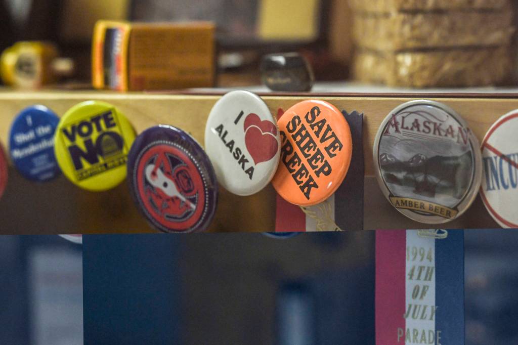 Pins inside the 1994 Juneau Time Capsule at the Hurff Ackerman Saunders Federal Building in Juneau on Friday, Aug. 9, 2019. (Michael Penn | Juneau Empire)