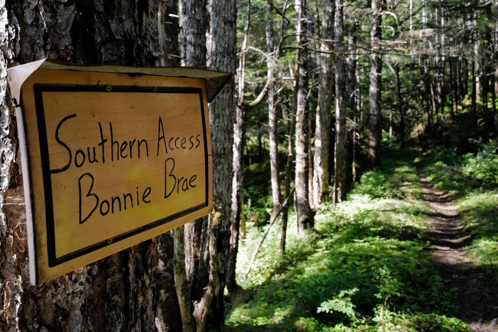 A sign marks the exit to the Bonnie Brae Subdivision just south of the new Treadwell Gorge reroute on the Treadwell Ditch Trail on Thursday, Aug. 8, 2019. (Michael Penn | Juneau Empire)