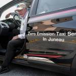 Mike Orford stands next to his brand new 2019 Chevy Bolt Electric Vehicle on Monday, Aug. 12, 2019. Orford, who has been a taxi driver for EverGreen Taxi, plans to put into zero emission vehicle into service to reduce costs and lead the way for a more sustainable way of life. (MIchael Penn | Juneau Empire)