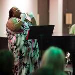 Jocelyn Miles sings for Juneau residents as she is accompanied by Tom Locher and David Sheakley-Early in this December 2018 photo. (Michael Penn | Juneau Empire File)