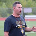 Juneau Huskies football coach Rich Sjoroos speaks to his team after practice at Thunder Mountain High School on Wednesday, Aug. 14, 2019. (Nolin Ainsworth | Juneau Empire)