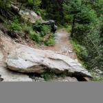 BEFORE: A estimated four-ton boulder on Perseverance Trail on Wednesday, Aug. 14, 2019. (Michael Penn | Juneau Empire)