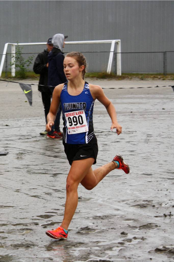 Thunder Mountain High Schools Kiah Dihle finishes the Douglas Island Mini-Meet in fifth place at Savikko Park on Douglas on Saturday, Aug. 17, 2019. Dihle was the first TMHS girls runner to the finish line with a time of 21 minutes, 4 seconds. (Nolin Ainsworth | Juneau Empire)