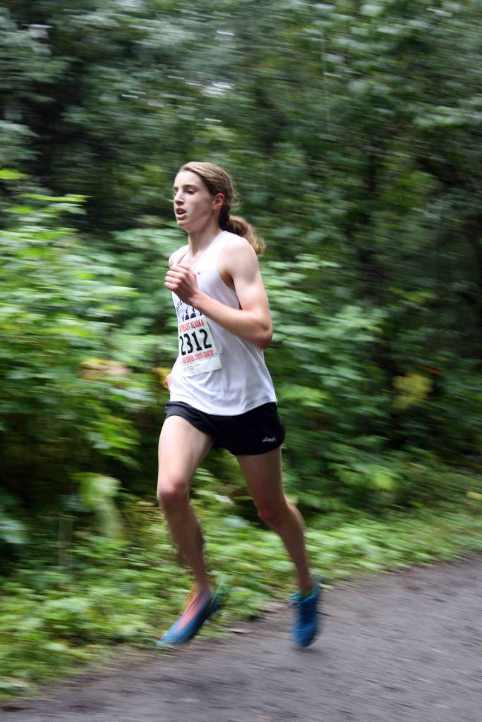 Juneau-Douglas High School: Yadaat.at Kales Finn Morley powers through the middle of his 5-kilometer win at the Douglas Island Mini-Meet on the Treadwell Mine Historic Trail on Saturday, Aug. 17, 2019. Morley won first place in the boys race with a time of 17 minutes, 47 seconds. (Nolin Ainsworth | Juneau Empire)