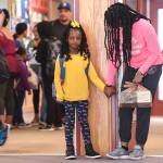 Ariyah Allen, holds hands with her mother, Odette, after arriving for the first day of school at Riverbend Elementary School on Monday, Aug. 19, 2019. (Michael Penn | Juneau Empire)