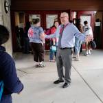 Principal Jim Thompson greets students on the first day of school at Floyd Dryden Middle School on Monday, Aug. 19, 2019. (Michael Penn | Juneau Empire)