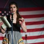 Erika Bergren reads poetry during the GRLZ open mic night at the The Rendezvous Bar on Wednesday, Aug. 14, 2019. (Michael Penn | Juneau Empire)