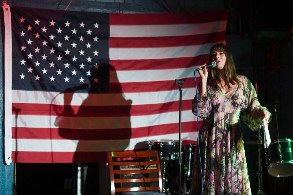 Dana Herndon performs with a story of Cleopatra during the GRLZ open mic night at the The Rendezvous Bar on Wednesday, Aug. 14, 2019. (Michael Penn | Juneau Empire)