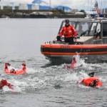 Members of the U.S. Coast Guard, U.S.C.G Dive Team, U.S. Army Dive Team and the Canadian Coast Guard participate in the annual Buoy Tender Olympics at Station Juneau on Wednesday, Aug. 21, 2019. (Michael Penn | Juneau Empire)