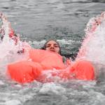 Brett Hyde, of the U.S. Army Dive Team, competes in the survival suit swim during the annual Buoy Tender Olympics at Station Juneau on Wednesday, Aug. 21, 2019. (Michael Penn | Juneau Empire)