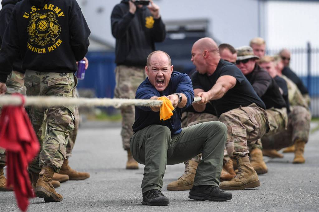 Shawn Price, of the U.S. Army Dive Team, fronts his team during the annual Buoy Tender Olympics at Station Juneau on Wednesday, Aug. 21, 2019. (Michael Penn | Juneau Empire)