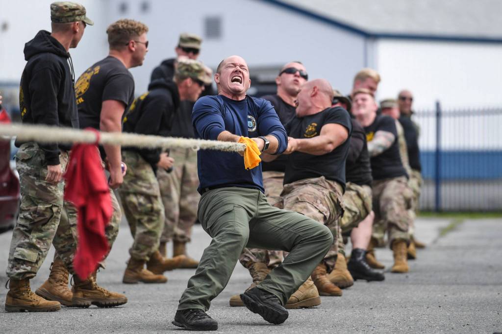 Shawn Price, of the U.S. Army Dive Team, fronts his team during the annual Buoy Tender Olympics at Station Juneau on Wednesday, Aug. 21, 2019. (Michael Penn | Juneau Empire)