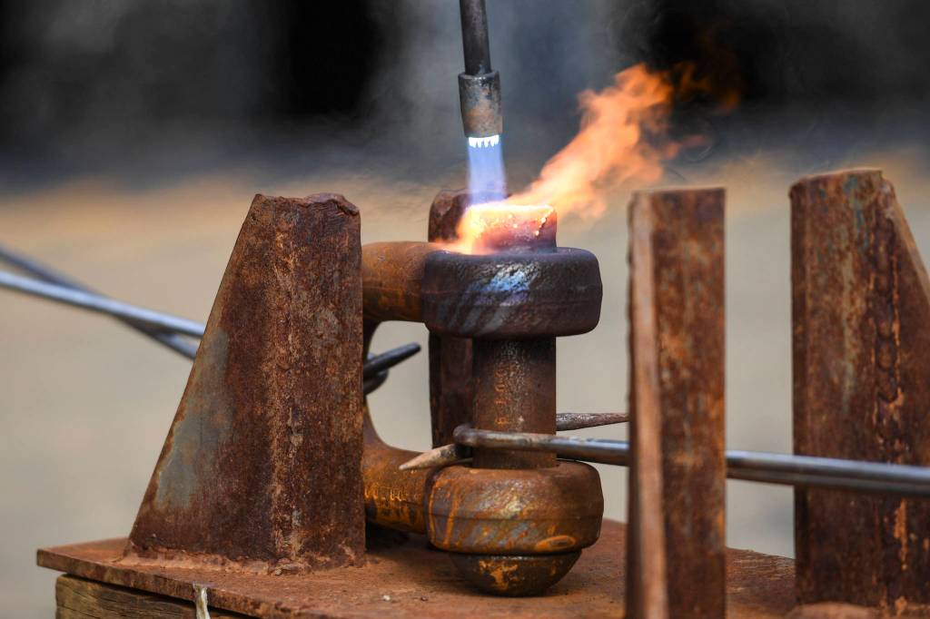 Members of the U.S. Coast Guard, U.S.C.G Dive Team, U.S. Army Dive Team and the Canadian Coast Guard participate in the annual Buoy Tender Olympics at Station Juneau on Wednesday, Aug. 21, 2019. (Michael Penn | Juneau Empire)