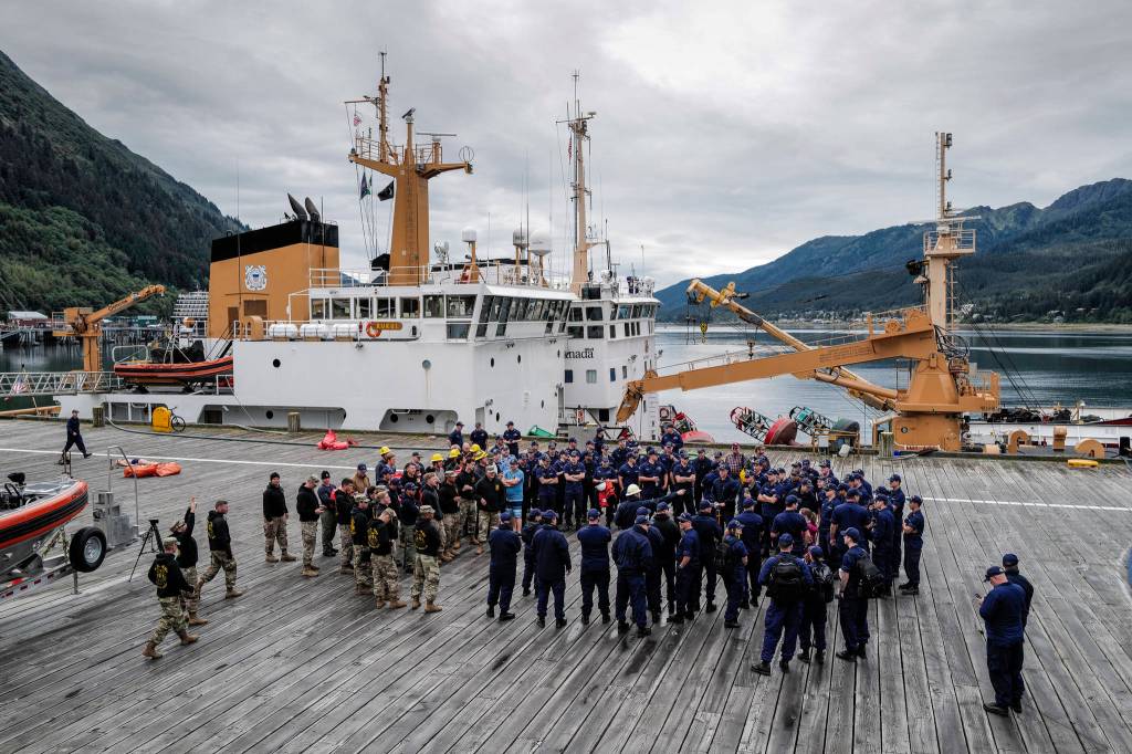 Members of the U.S. Coast Guard, U.S.C.G Dive Team, U.S. Army Dive Team and the Canadian Coast Guard gather for the annual Buoy Tender Olympics at Station Juneau on Wednesday, Aug. 21, 2019. (Michael Penn | Juneau Empire)