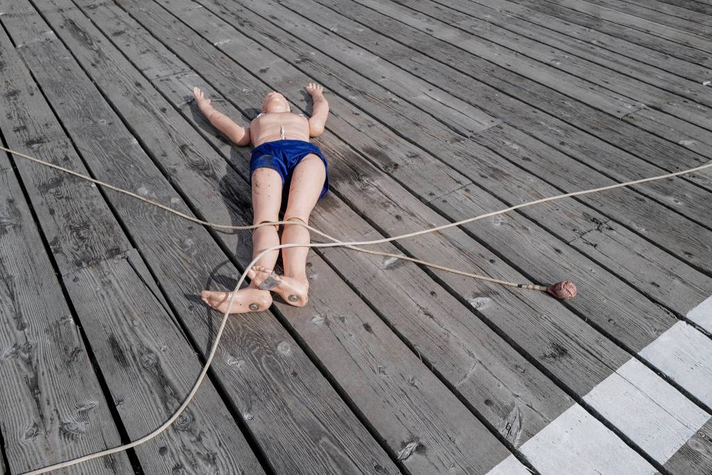 Members of the U.S. Coast Guard, U.S.C.G Dive Team, U.S. Army Dive Team and the Canadian Coast Guard participate in the annual Buoy Tender Olympics at Station Juneau on Wednesday, Aug. 21, 2019. (Michael Penn | Juneau Empire)