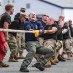 DV1 Shawn Price, of the U.S. Army Dive Team fronts his team during the annual Buoy Tender Olympics at Station Juneau on Wednesday, Aug. 21, 2019. (Michael Penn | Juneau Empire)