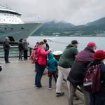 Visitors take in Juneau downtown harbor on June 18, 2019. (Michael Penn | Juneau Empire)
