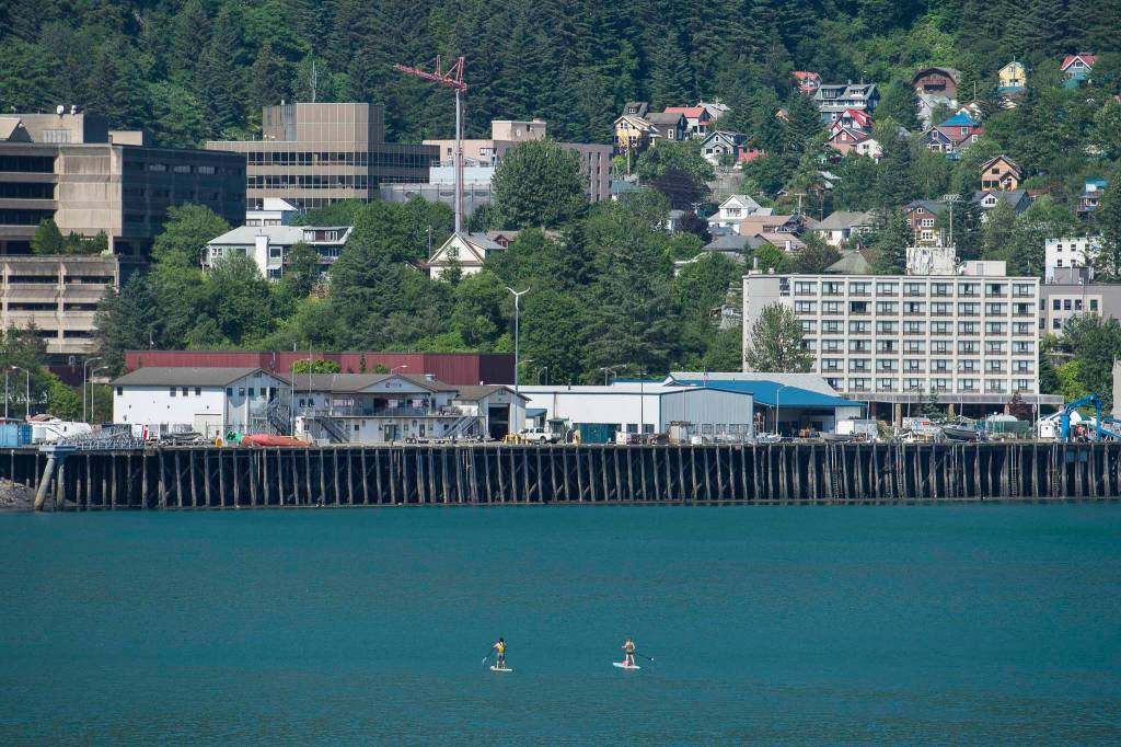 Lionel Uddipa and Tessany Alrich explore Juneaus downtown harbor by paddleboard on Thursday, June 27, 2019. (Michael Penn | Juneau Empire)