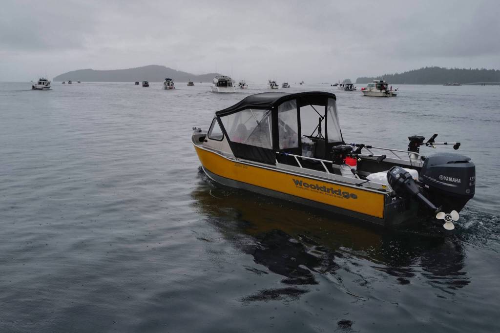 Fishing boats stream out of the Don D. Statter Boat Harbor in Auke Bay for the start of the Golden North Salmon Derby on Friday, Aug. 23, 2019. (Michael Penn | Juneau Empire)