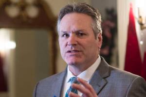 Gov. Mike Dunleavy speaks to members of the media before welcoming Juneau residents to the Governors Open House on Tuesday, Dec. 11, 2018. (Michael Penn | Juneau Empire)