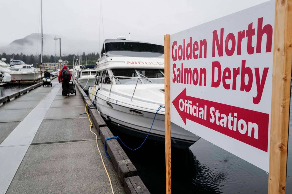 Fishermen head to their boats at the Don D. Statter Boat Harbor in Auke Bay at the start of the Golden North Salmon Derby on Friday, Aug. 23, 2019. (Michael Penn | Juneau Empire)
