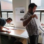 Seattle-based photographer Eirik Johnson, left, works with Ben Huff, a local photographer and editor of Ice Fog Press, on a hand-made book of Johnsons photographs titled Barrow Cabins on Wednesday, Aug. 21, 2019. (Michael Penn | Juneau Empire)