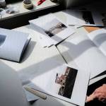 Seattle-based photographer Eirik Johnson works with Ben Huff, a local photographer and editor of Ice Fog Press, on a hand-made book of Johnsons photographs titled Barrow Cabins on Wednesday, Aug. 21, 2019. (Michael Penn | Juneau Empire)