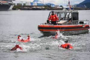 Members of the U.S. Coast Guard, U.S.C.G Dive Team, U.S. Army Dive Team and the Canadian Coast Guard participate in the annual Buoy Tender Olympics at Station Juneau on Wednesday, Aug. 21, 2019. (Michael Penn | Juneau Empire)