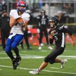 Antelope Unions Dylan Thomas, left, makes a catch in front of Juneaus Wallace Adams at Adair-Kennedy Memorial Field on Saturday, Aug. 24, 2019. Juneau won 56-18. (Michael Penn | Juneau Empire)