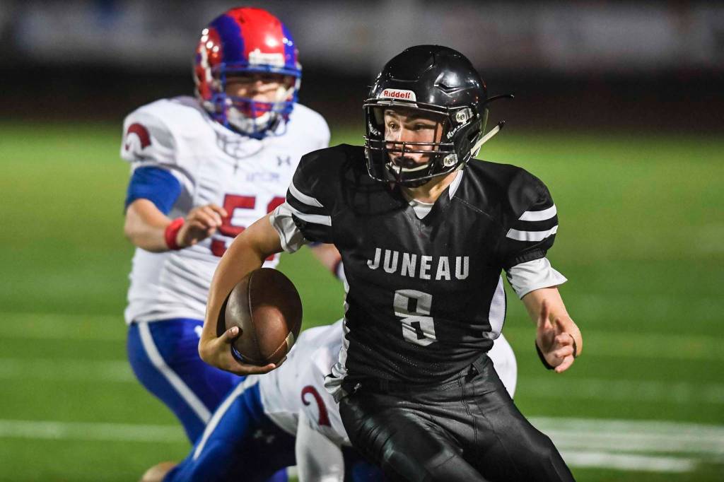 Juneaus Noah Chambers scrambles against Antelope Union in the third quarter at Adair-Kennedy Memorial Field on Saturday, Aug. 24, 2019. Juneau won 56-18. (Michael Penn | Juneau Empire)