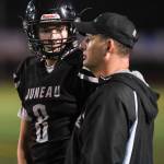 Juneaus Noah Chambers receives a play by coach Rich Sjoroos as they play against Antelope Union in the third quarter at Adair-Kennedy Memorial Field on Saturday, Aug. 24, 2019. Juneau won 56-18. (Michael Penn | Juneau Empire)