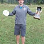 Joe Schacht, of Anchorage, poses with the Greatland Cup Disc Golf Tournament trophy at Aantiyeik Park. (Courtesy Photo | Russell Sandstrom)