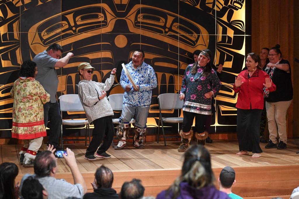 Sealaska Heritage Institute Artists-in-Residence John Waghiyi and his wife, Arlene Annogiyuk Waghiyi, from Savoonga, invite audience members to dance to their St. Lawrence Island rock and roll song at the Walter Soboleff Center on Wednesday, Aug. 28, 2019. (Michael Penn | Juneau Empire)