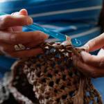 Star White crochets a sleeping mat for Juneaus homeless using plastic grocery bags on Thursday, Aug. 29, 2019. (Michael Penn | Juneau Empire)