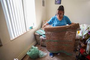 Star White displays a sleeping mat she crocheted for Juneaus homeless using 467 plastic grocery bags on Thursday, Aug. 29, 2019. (Michael Penn | Juneau Empire)