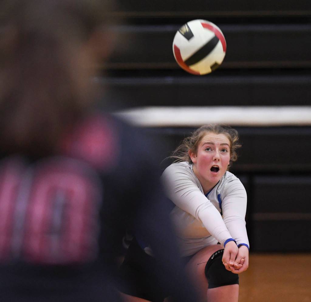 Thunder Mountains Ann Steinman bumps the ball up against Juneau-Douglas at the Volleyball Jamboree at Juneau-Douglas High School: Yadaa.at Kalé on Friday, Aug. 30, 2019. (Michael Penn | Juneau Empire)
