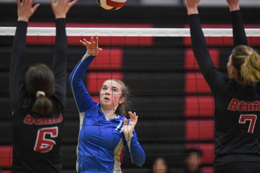 Thunder Mountains Sam Dilley, center, spikes the ball against Juneau-Douglas Addie Prussing, left, and Jojo Griggs at the Volleyball Jamboree at Juneau-Douglas High School: Yadaa.at Kalé on Friday, Aug. 30, 2019. (Michael Penn | Juneau Empire)
