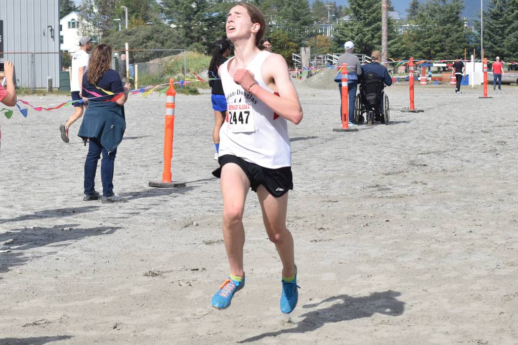 Juneau-Douglas High School: Yadaat.at Kales Finn Morley crosses the finish line of the Capital City Invitational at Sandy Beach on Saturday, Aug. 31, 2019. (Nolin Ainsworth | Juneau Empire)