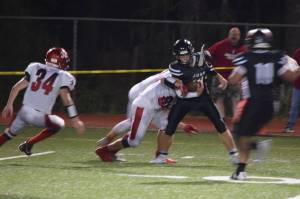 Juneau Huskies receiver Wallace Adams comes down with the ball in the fourth quarter in a nonconference game against the Kenai Kardinals at Adair-Kennedy Memorial Park on Saturday, Aug. 31, 2019. (Nolin Ainsworth | Juneau Empire)