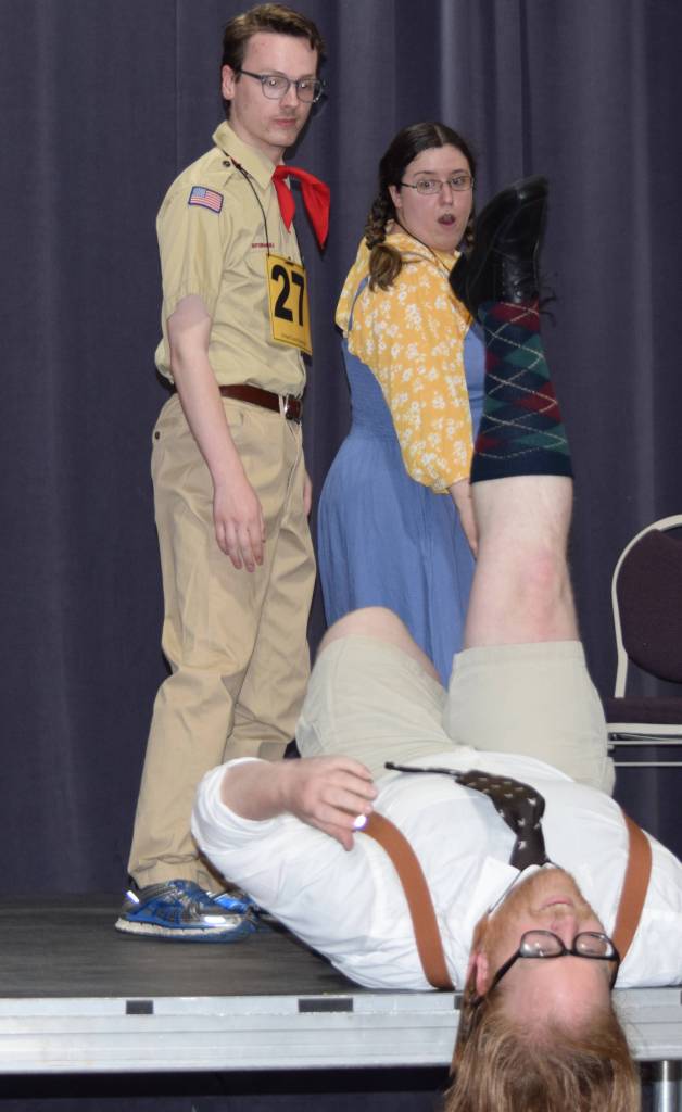 Chip Tolentino (Zebadiah Bodine) and Logainne Schwartzandgrubenniere (Kristina Paulick) react to a indisposed William Barfee (Nomi Saxton) during rehearsals for The 25th Annual Putnam County Spelling Bee Tuesday, Sept. 3, 2019. (Ben Hohenstatt | Capital City Weekly)